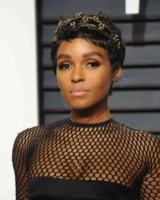 janelle monae wearing a gilded headband