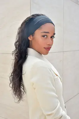 Laura Harrier long wavy hair with thick black headband