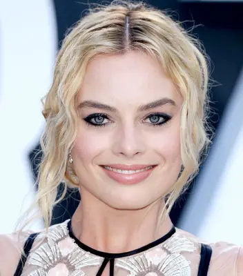 slimming low bun with loose strands hairstyle