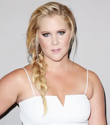 slimming side swept braid and loose strands hairstyle