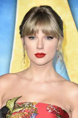 Taylor Swift with thick fringe and updo