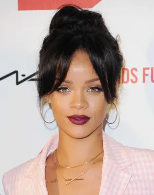 Rihanna with slimming updo and curtain bangs