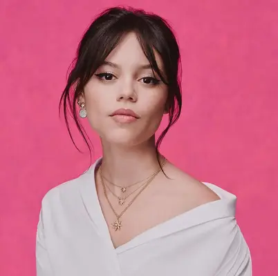 Loose updo with loose tendrils around face