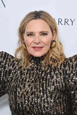 Kim Cattral wearing a middle part lob