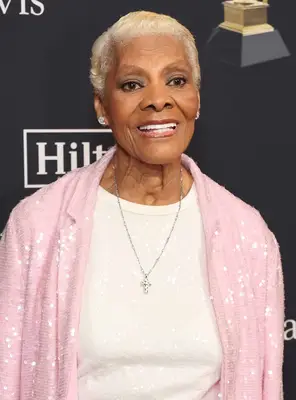 Dionne Warwick wearing a short blonde haircut