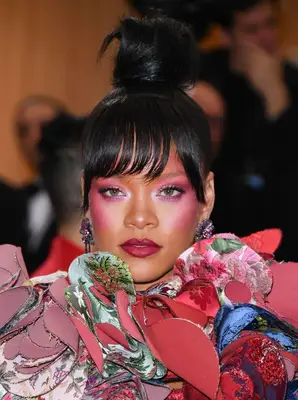 Rihanna with a topknot bun and blunt bangs at the 2017 Met Gala in New York City