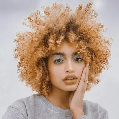 Woman with curly orange hair