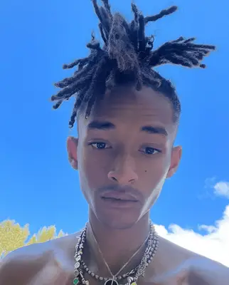 Jon Batiste at the Met Gala 2024 wearing high top locs with faded sides