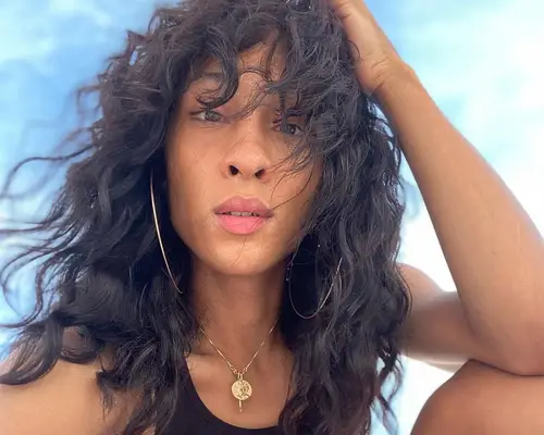 Actress and singer Michaela Jae Rodriguez with 2C hair.