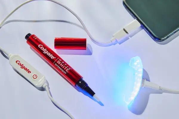 A closeup of the Colgate ComfortFit LED Teeth Whitening Kit on a tabletop