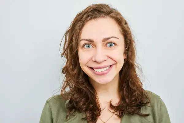 Close up of person applying whitener to their tooth