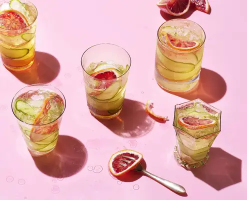 splashy cocktails on pink table