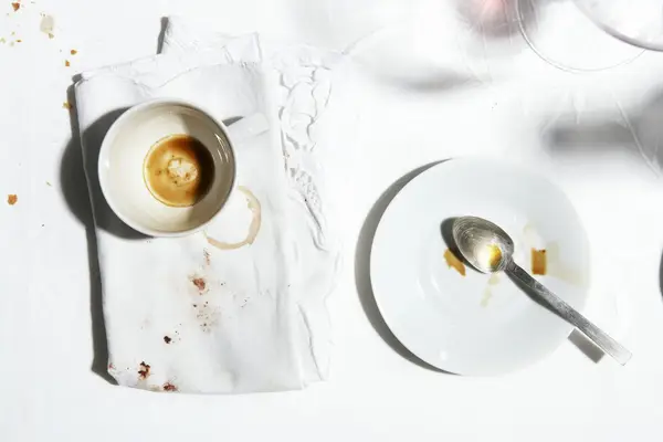 empty coffee mug and saucer