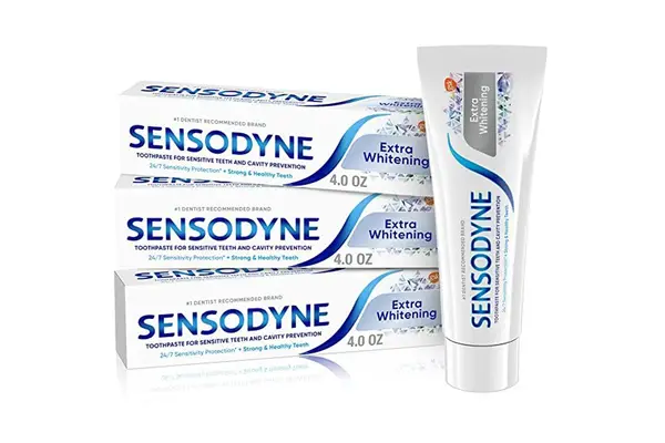 a hand squeezing Tom