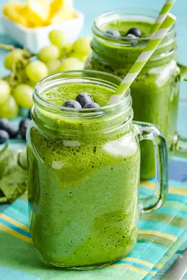 Green smoothie with blueberries on top