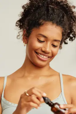 person holding essential oil