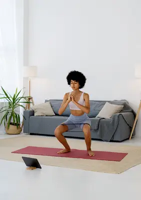 person does iyengar type yoga practice at home