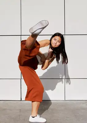 young femme kick boxing