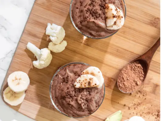 Composed image of two smoothies and a spoon full of protein powder