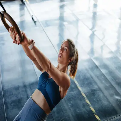 woman working out on rings