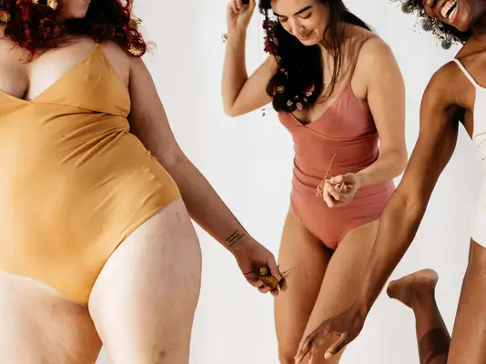 women in bathing suits dancing