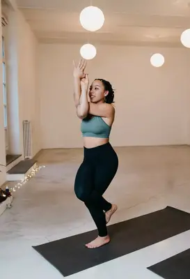 person doing eagle pose at home