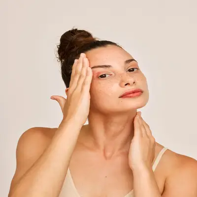 woman rubbing her head