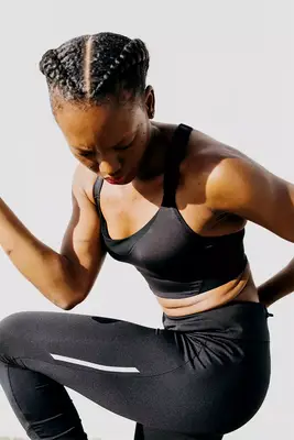 black femme exercising in the sun