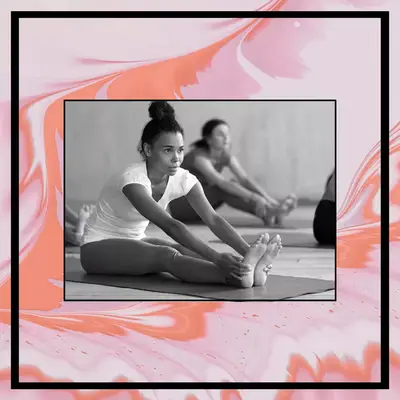 woman stretching in forward bend yoga pose to relieve bloating