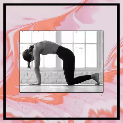 woman doing cat cow stretch to relieve bloating