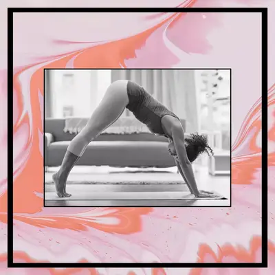 woman doing downward dog yoga stretch to relieve bloating