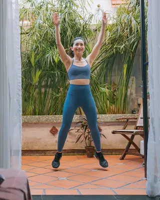 woman doing jumping jacks