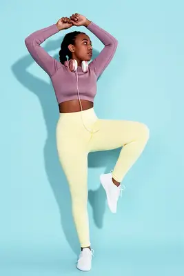 person does single leg balance in studio