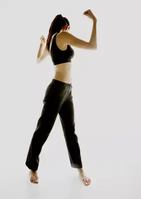 person does standing oblique crunch exercise