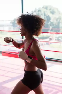 person in boxing ring exercising