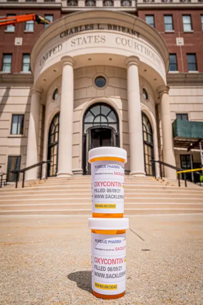 Prescription bottles of OxyContin seen dropped outside the...