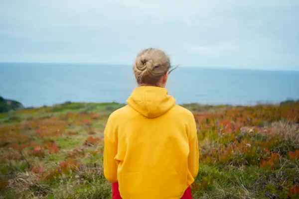 Young woman relaxing near ocean