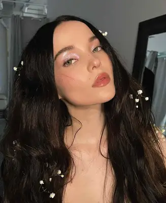 Dove Cameron wears shimmering eye makeup