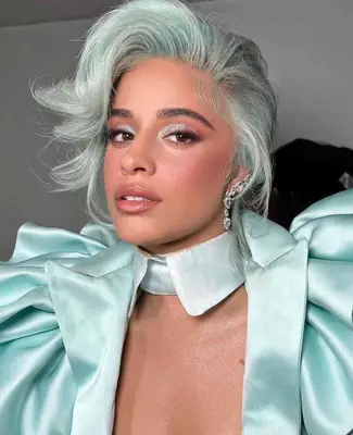 Camilla Cabello wears a sparkling mint light blue eyeshadow look