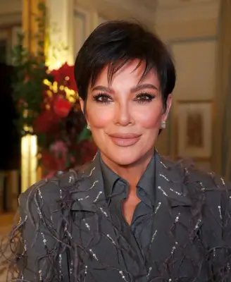 Kris Jenner wears visible black eyeliner and nude lipstick makeup look