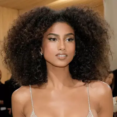 Imaan Hammam with natural hair and golden makeup