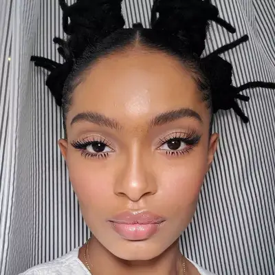 Yara Shahidi with over the top eyelashes