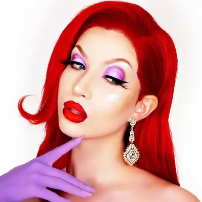 Abby Roberts wears a Jessica Rabbit-inspired makeup look with purple eyeshadow and red lipstick