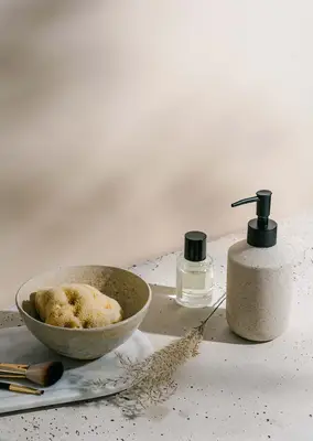 witch hazel and soap bottle with brushes still life