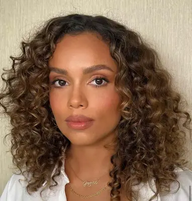 model poses wearing soft berry nude makeup look