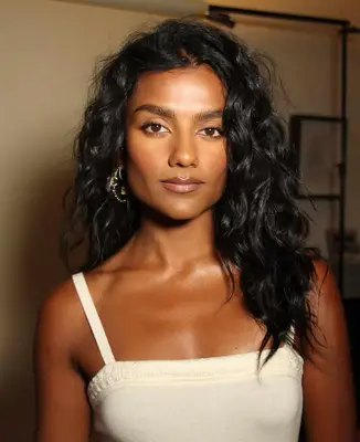 model poses wearing soft nude makeup look