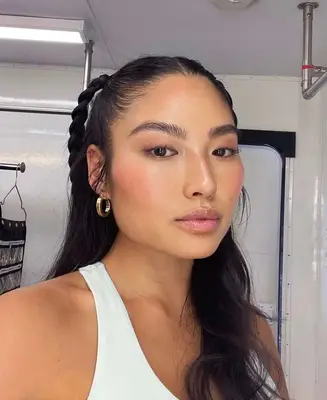 model poses wearing light pink and nude makeup look