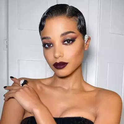 Ella Balinska in deep burgundy makeup and a matching lip