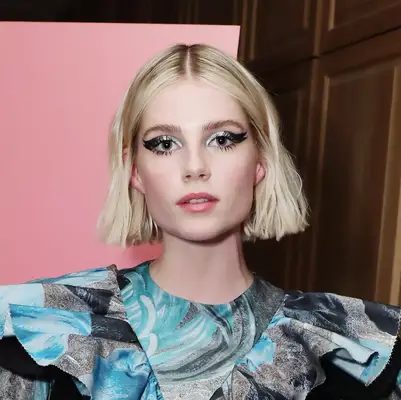 Lucy Boynton wearing a bold winged liner and wavy bob at the 2019 