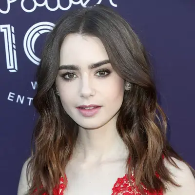 Lily Collins with a smokey brown under eyeliner look at the Hollywood Reporter